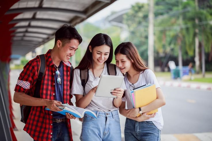 Students working together with a tablet